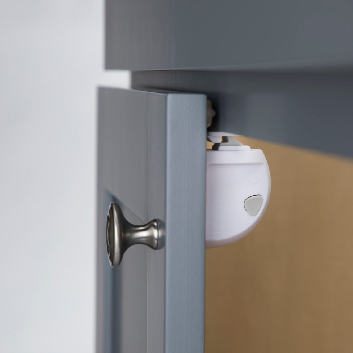 Lock shown properly installed on a cabinet door