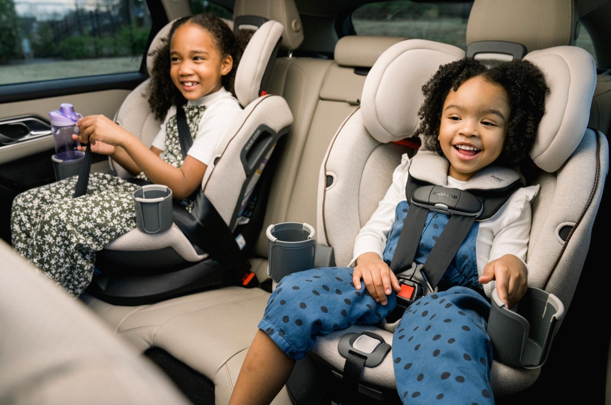 Two children in car seats.