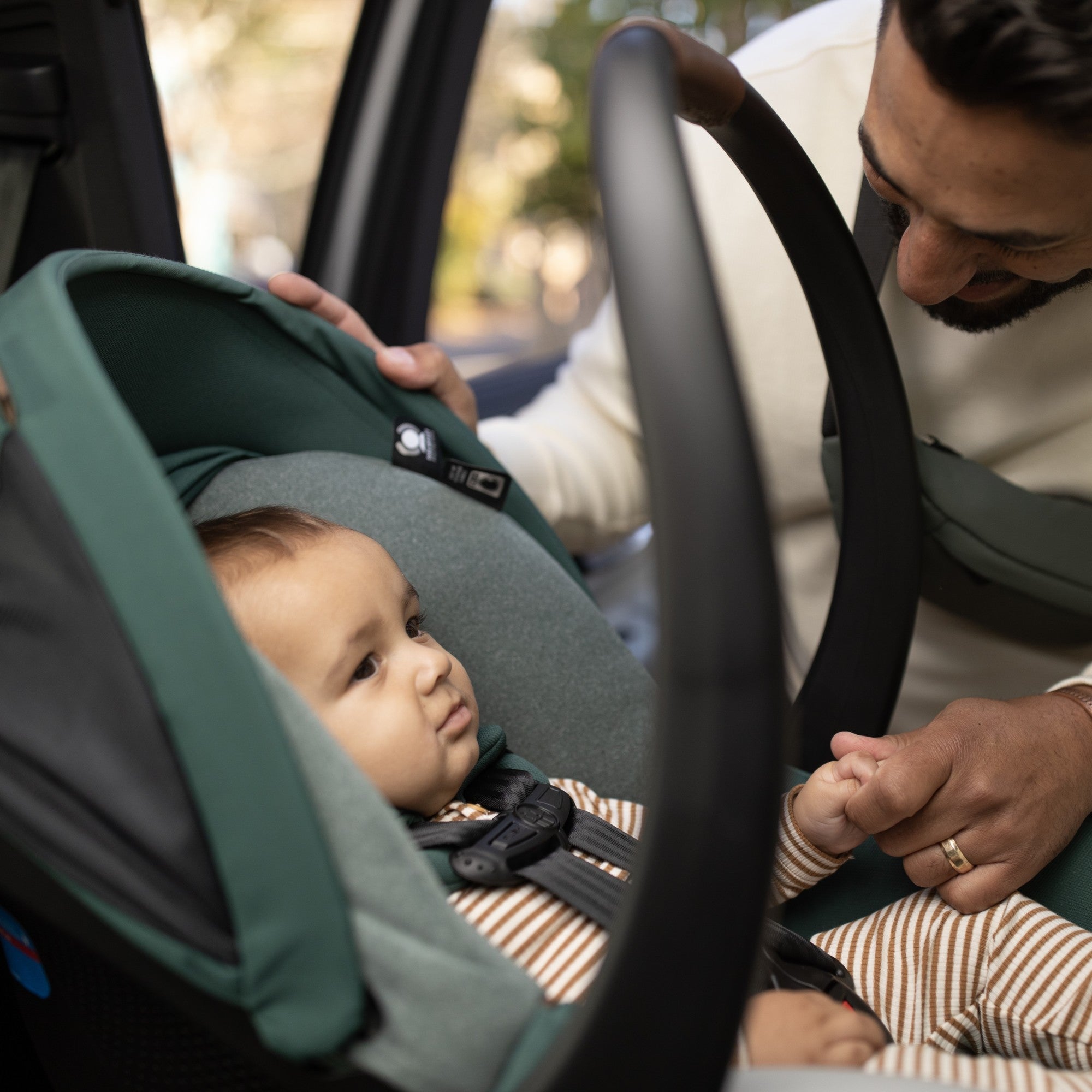 Mico™ Luxe+ Infant Car Seat - father doting on baby in car seat