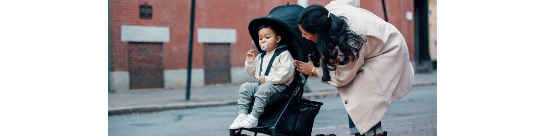 Mother tending to child in stroller