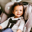 toddler boy buckled in convertible car seat