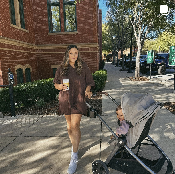 woman with stroller in city