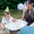 Moa 8-in-1 High Chair - baby with birthday hat in high chair with mother looking on