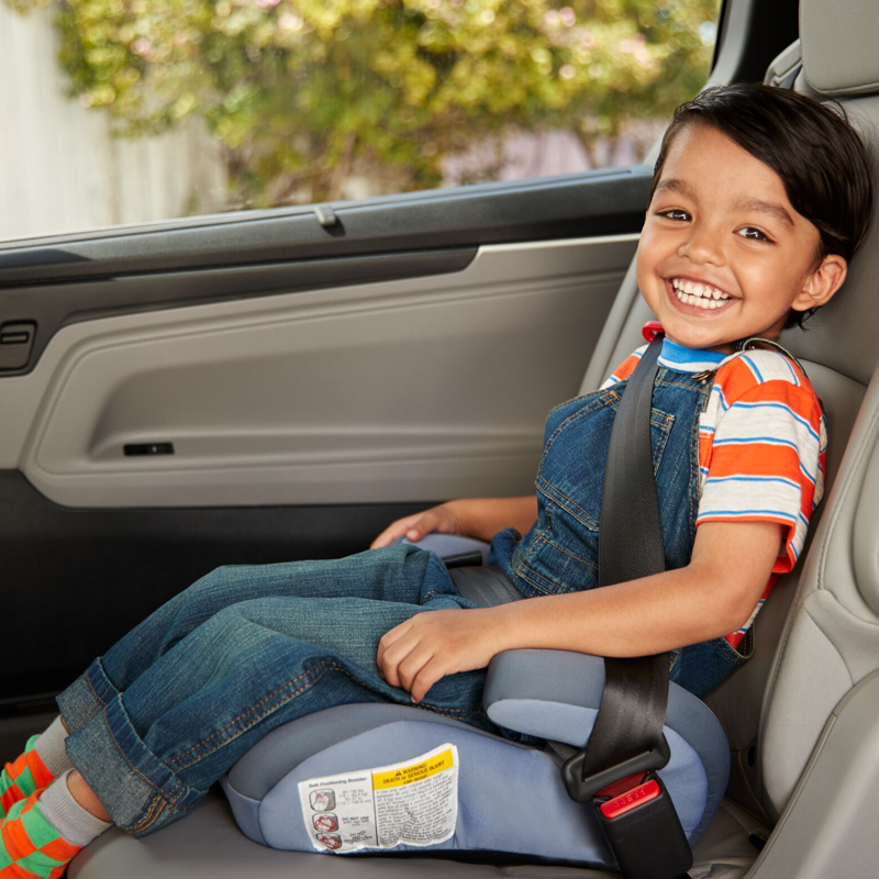 child in booster car seat