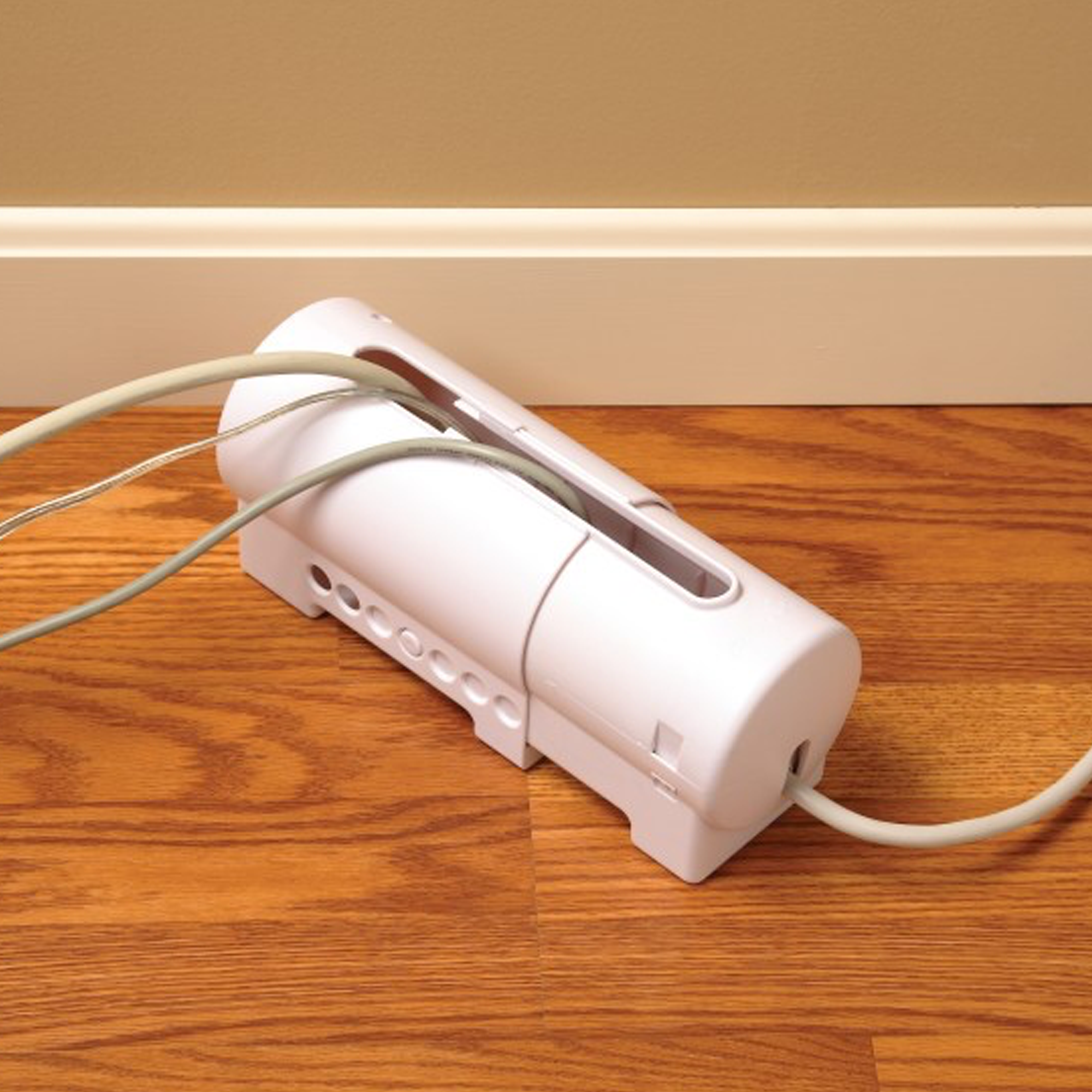power strip protector in use with multiple wires going through it