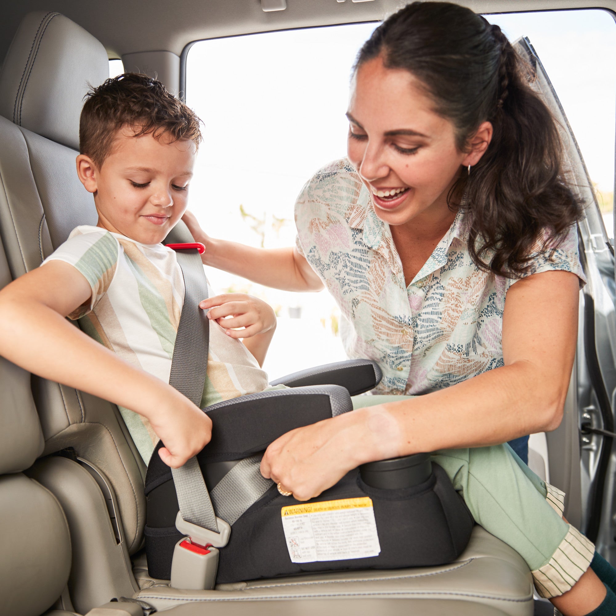 Boost-and-Go™ Lite Backless Booster - mother buckling in son