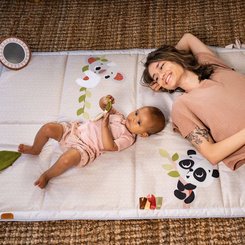 mom and baby on boho chic mat