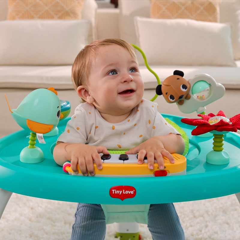 baby in stationary activity center