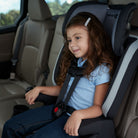 Boost-and-Go All-in-One Harness Booster Car Seat - Dunes Edge - girl grinning as she sits in car seat
