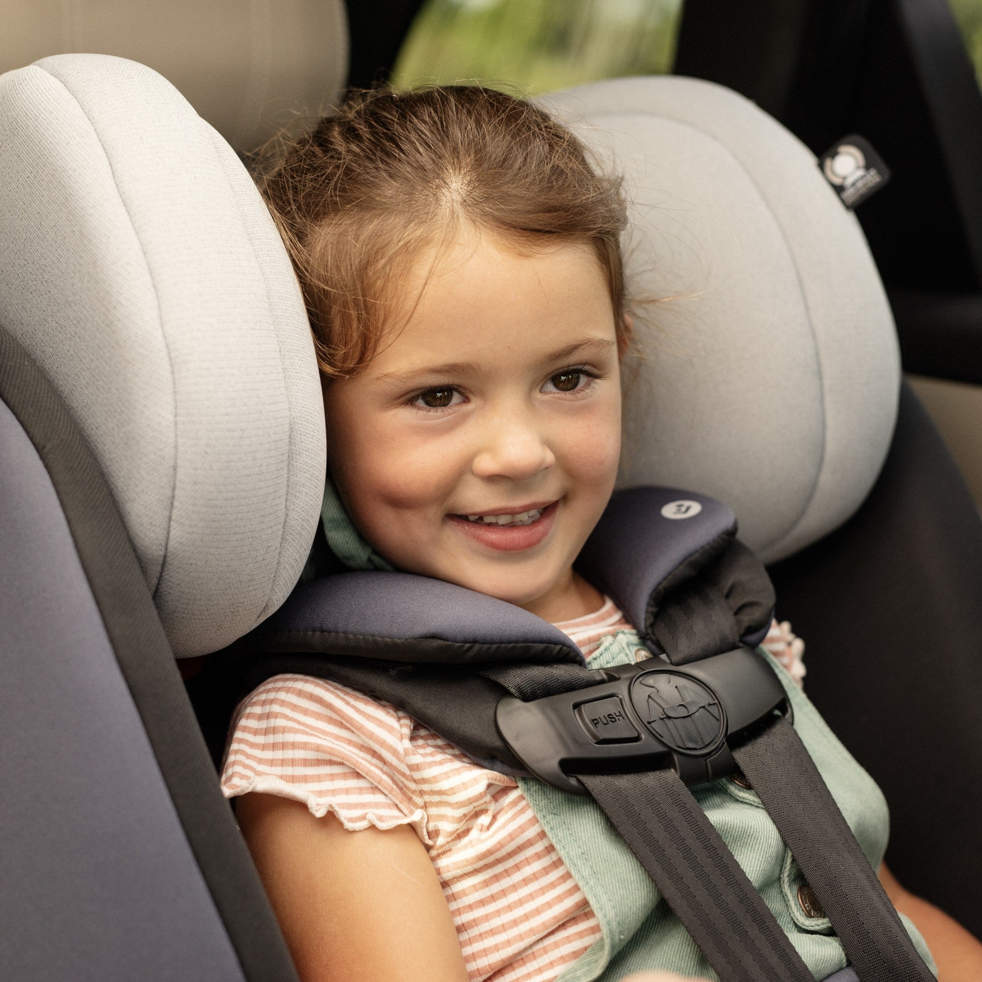 Pria™ All-in-One Convertible Car Seat - girl smiling in car seat