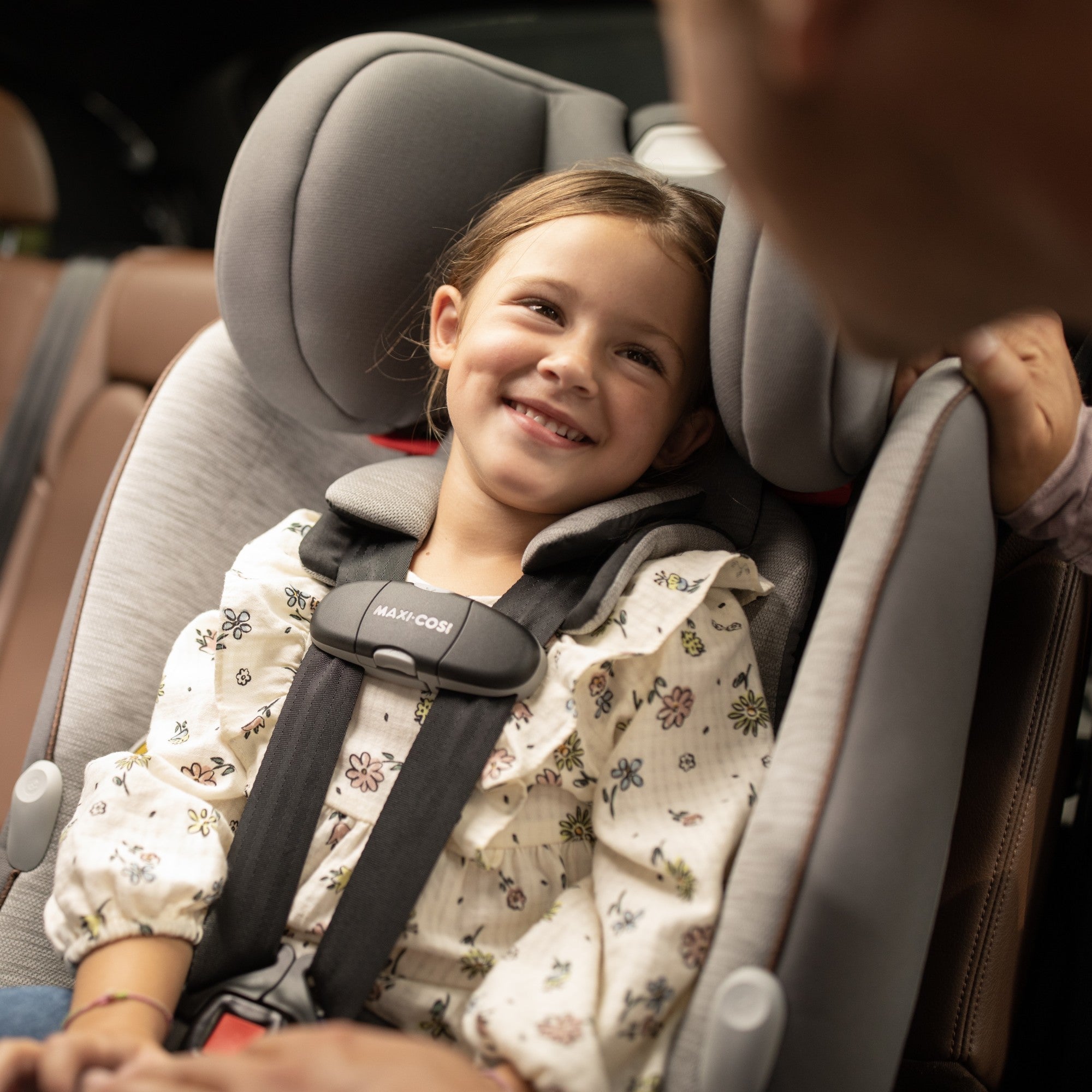 Pria™ Max All-in-One Convertible Car Seat - daughter smiling at parent while sitting in seat