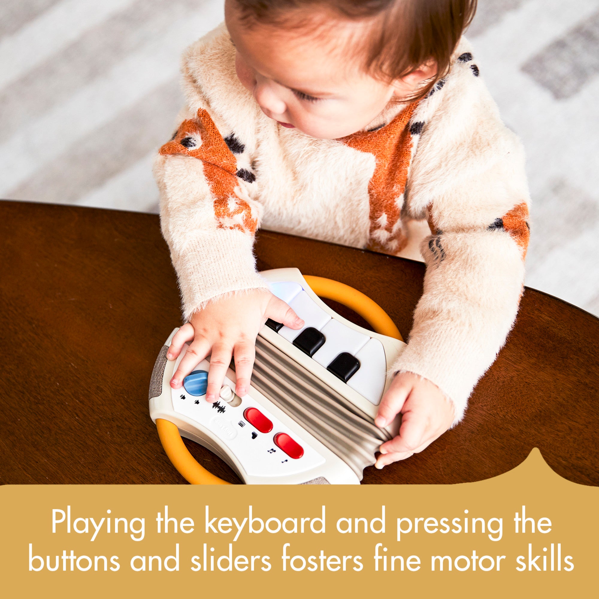 Tiny Rockers Accordion - Playing the keyboard and pressing the buttons and sliders fosters fine motor skills