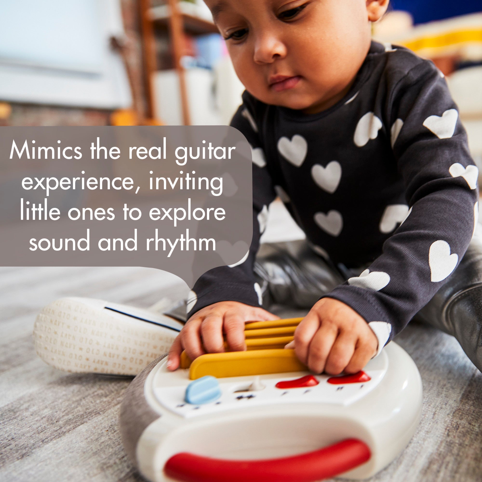 Tiny Rockers Guitar - Mimics the real guitar experience, inviting little ones to explore sound and rhythm