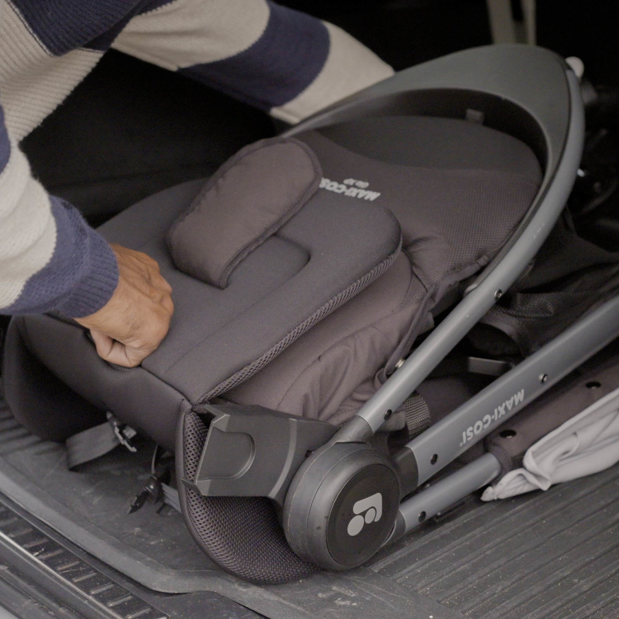 Gia XP Luxe 3-Wheel Travel System - Travel system folded up in back of car